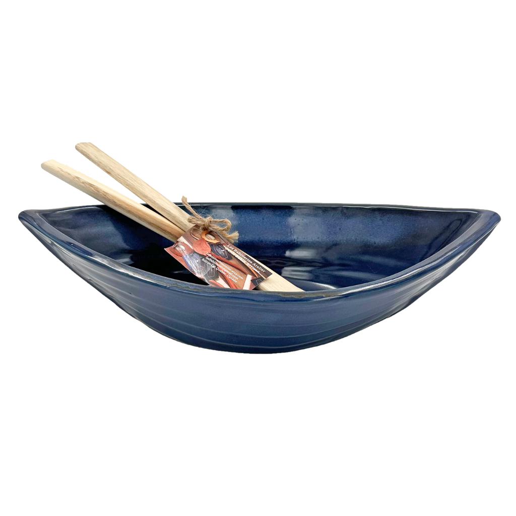 Dark blue dory serving bowl with paddle servers.