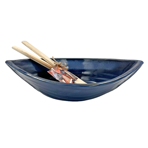 Dark blue dory serving bowl with paddle servers.