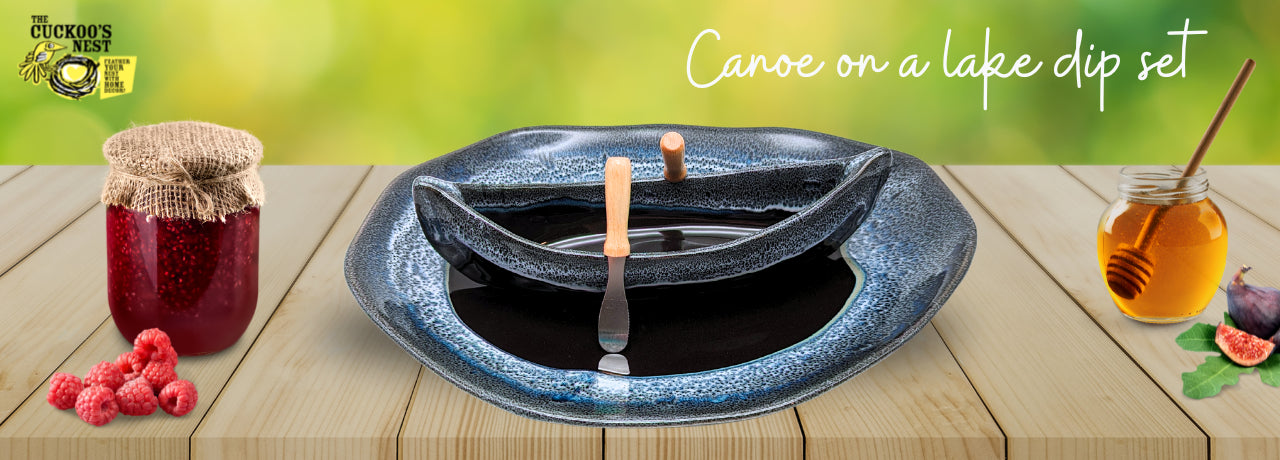 canoe dip pot on serving plate. black and blue handmade pottery